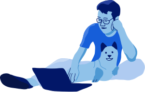 Man sitting with dog laughing using laptop